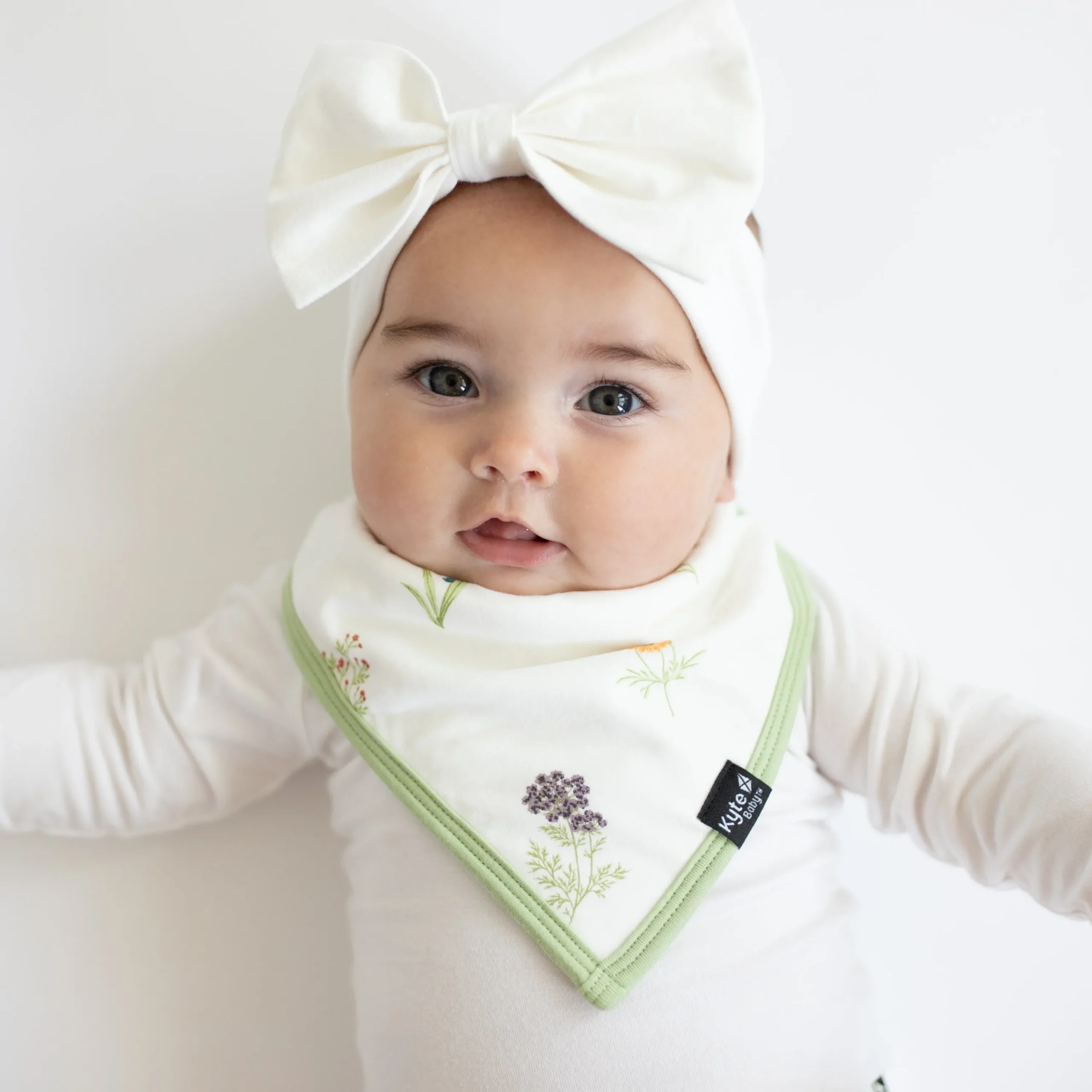 Kyte Baby Bib in Wildflower Hot