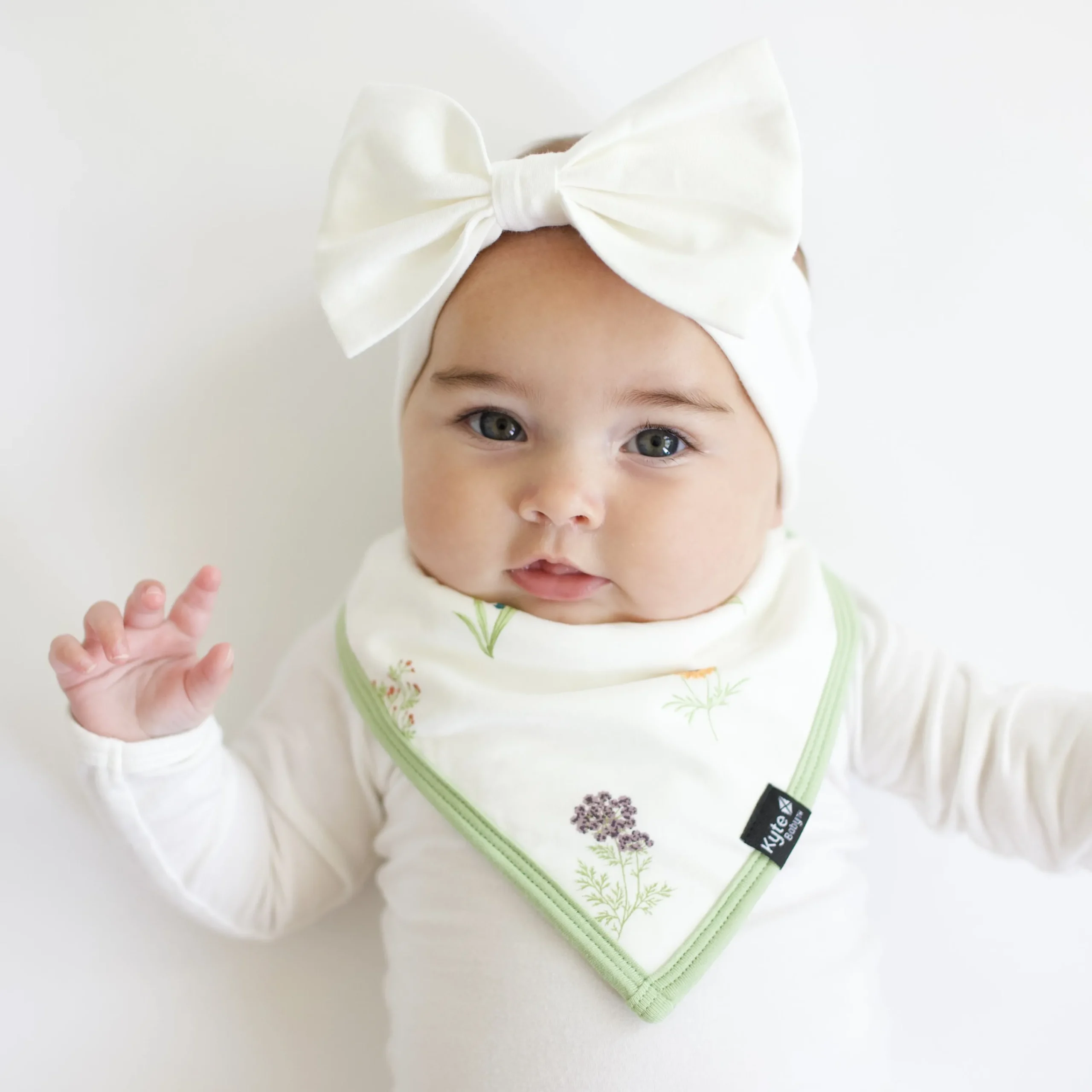 Kyte Baby Bib in Wildflower Hot