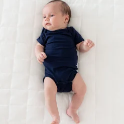 Kyte Baby Bodysuit in Navy Hot