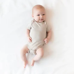 Kyte Baby Bodysuit in Oat Clearance