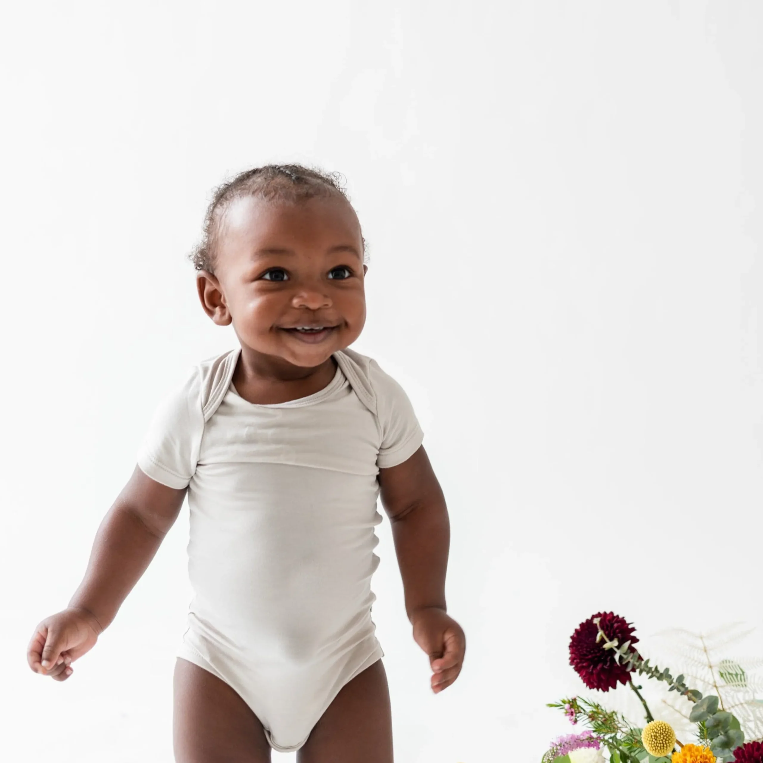 Kyte Baby Bodysuit in Oat Clearance