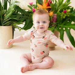 Kyte Baby Bodysuit in Peach Hot