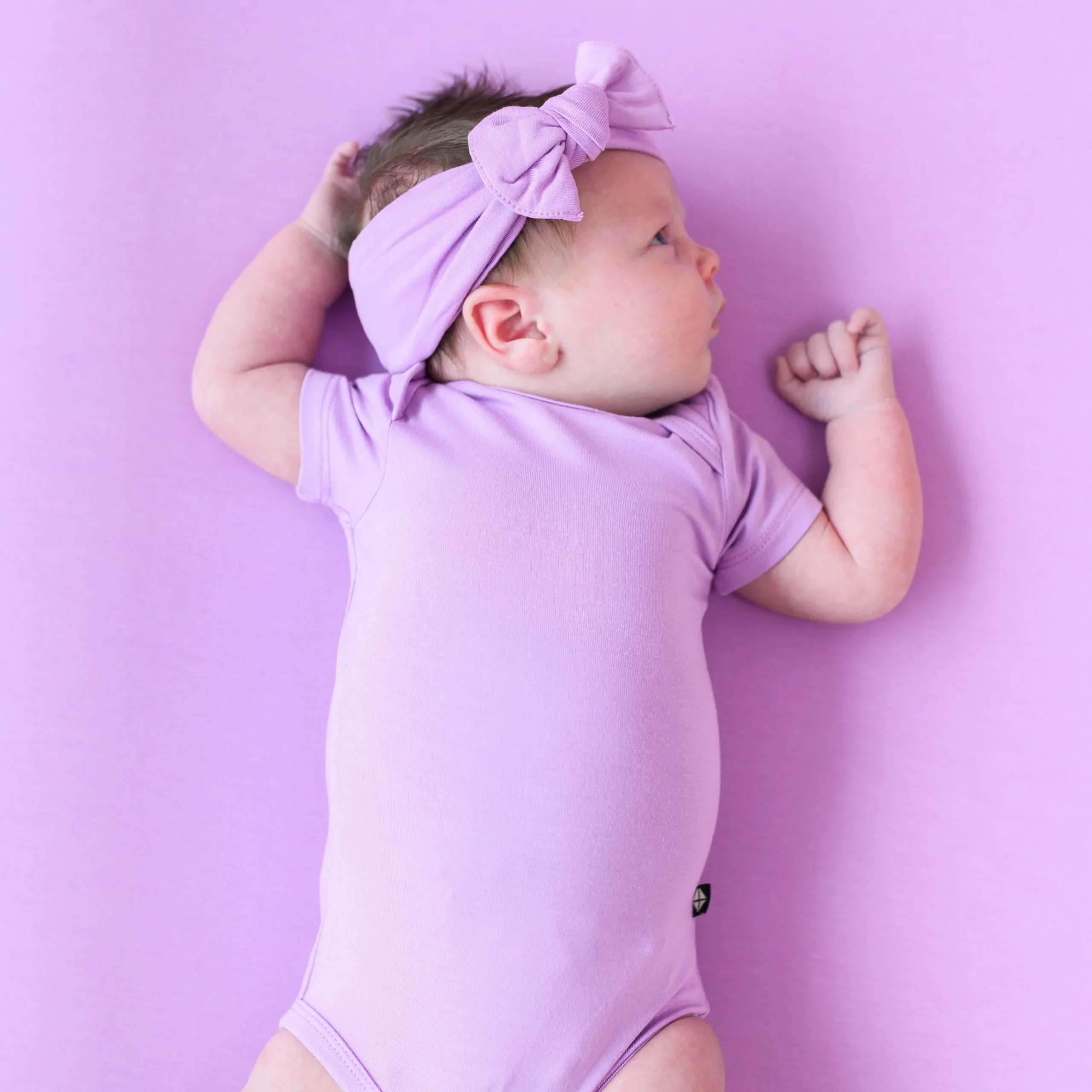 Kyte Baby Bodysuit in Poi New