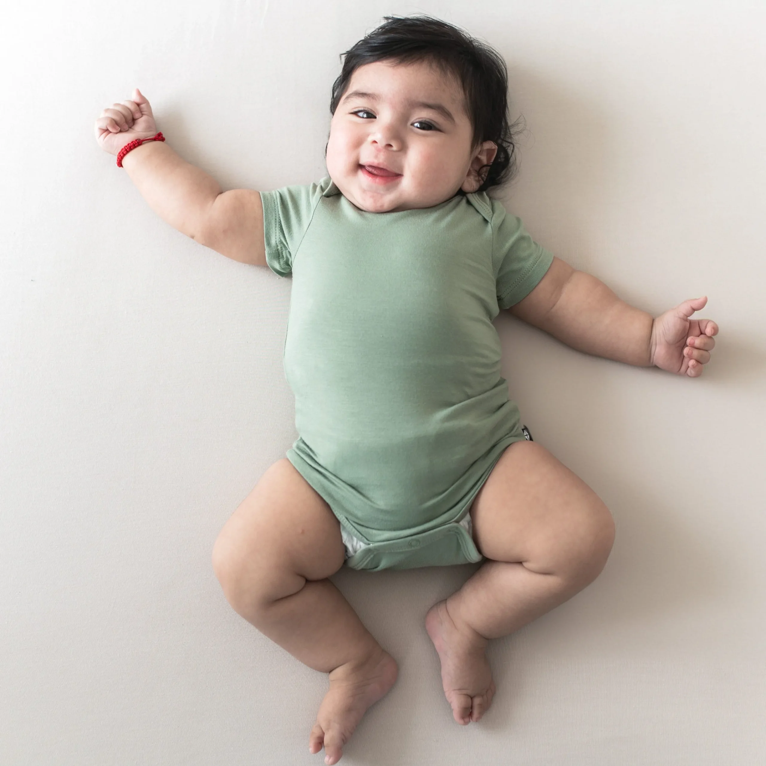 Kyte Baby Bodysuit in Thyme Outlet