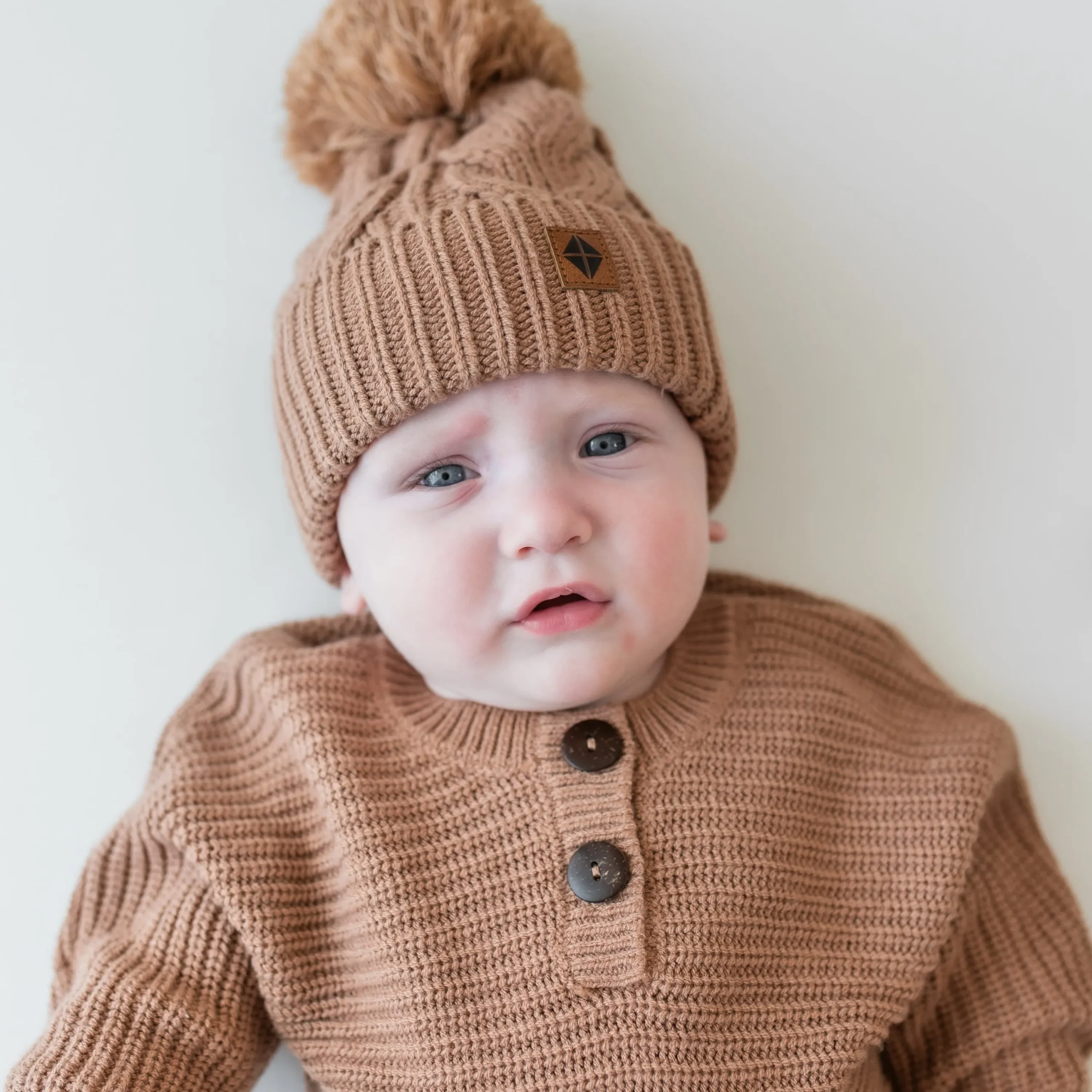 Kyte Baby Chunky Cable Knit Beanie in Latte