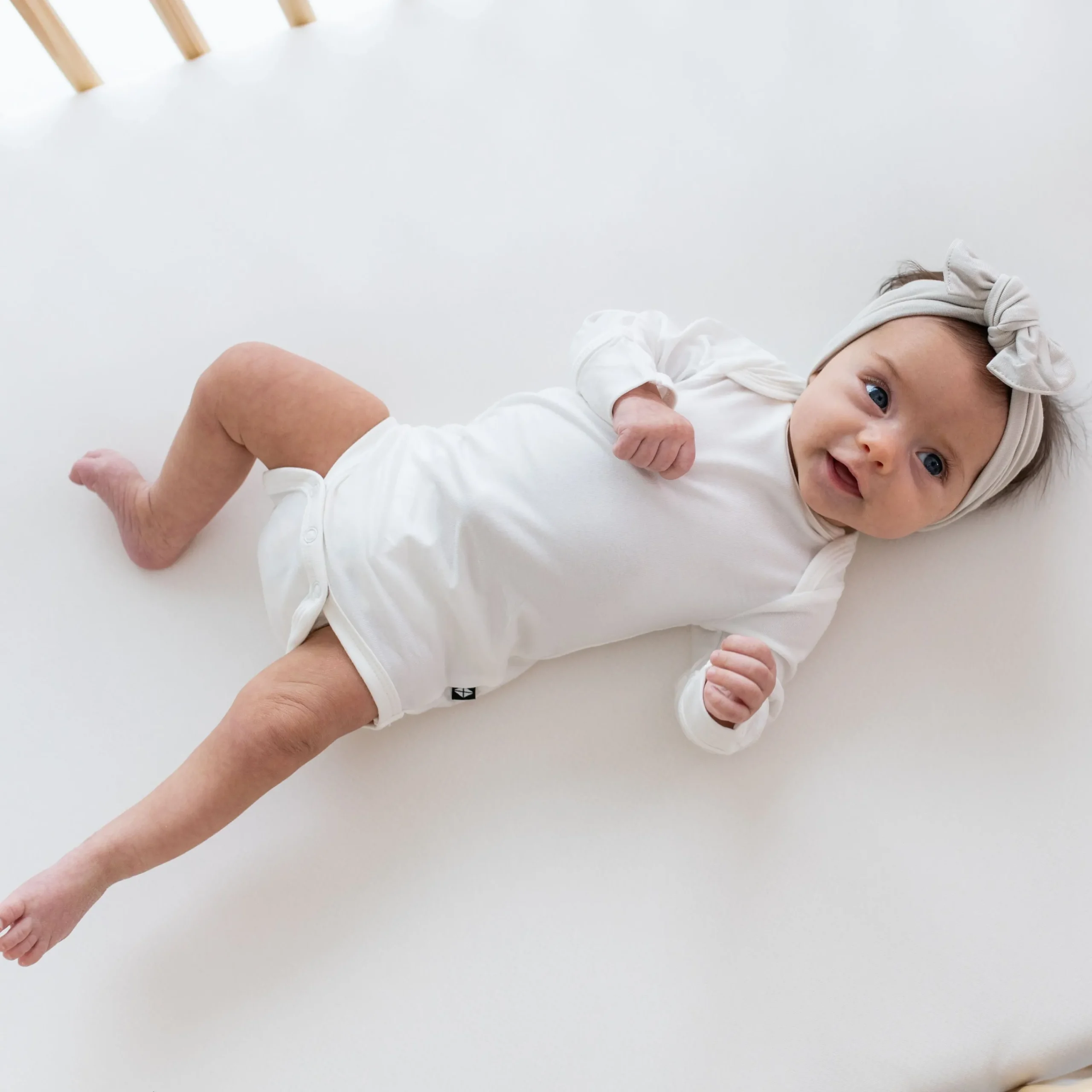 Kyte Baby Long Sleeve Bodysuit in Cloud Hot