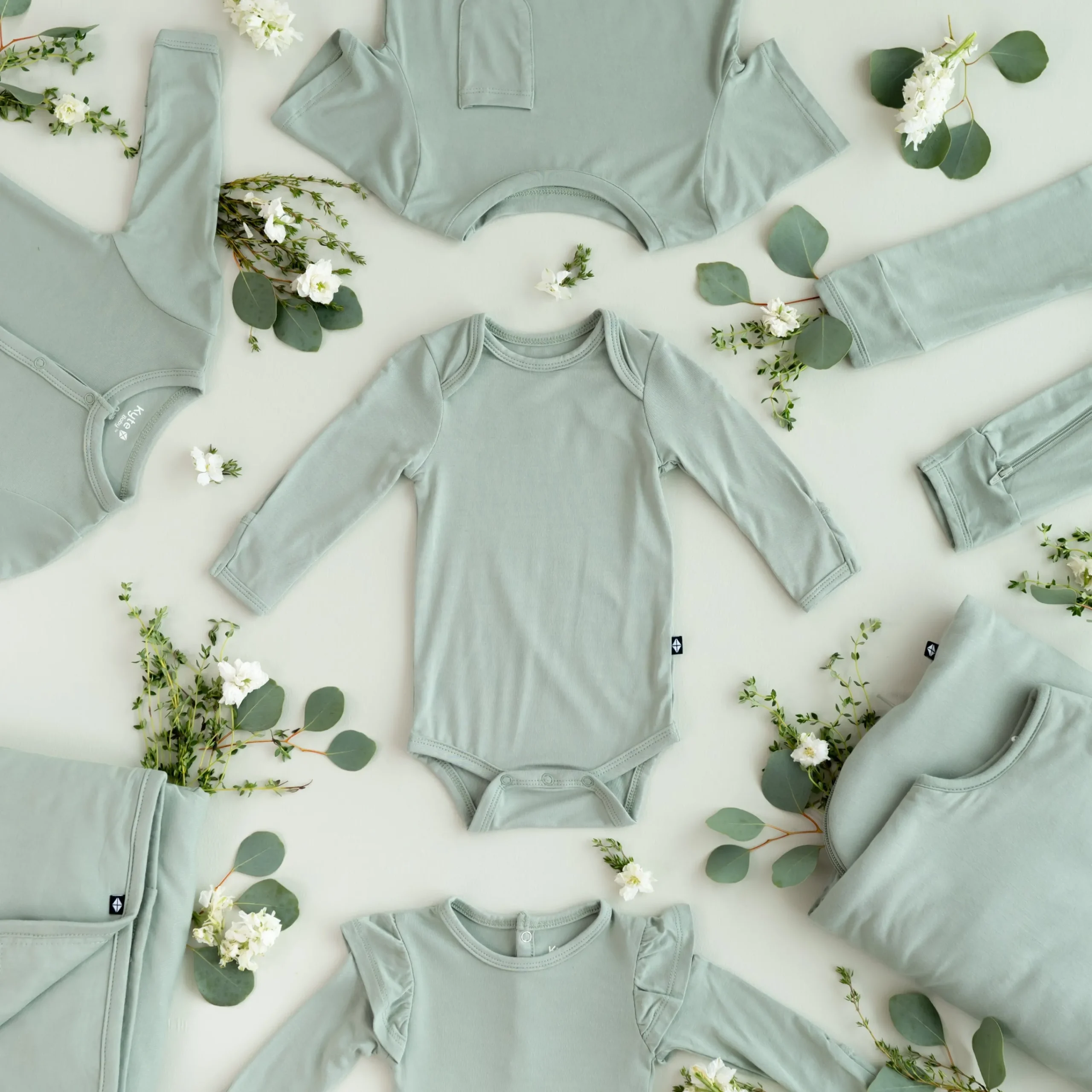 Kyte Baby Long Sleeve Bodysuit in Thyme Hot