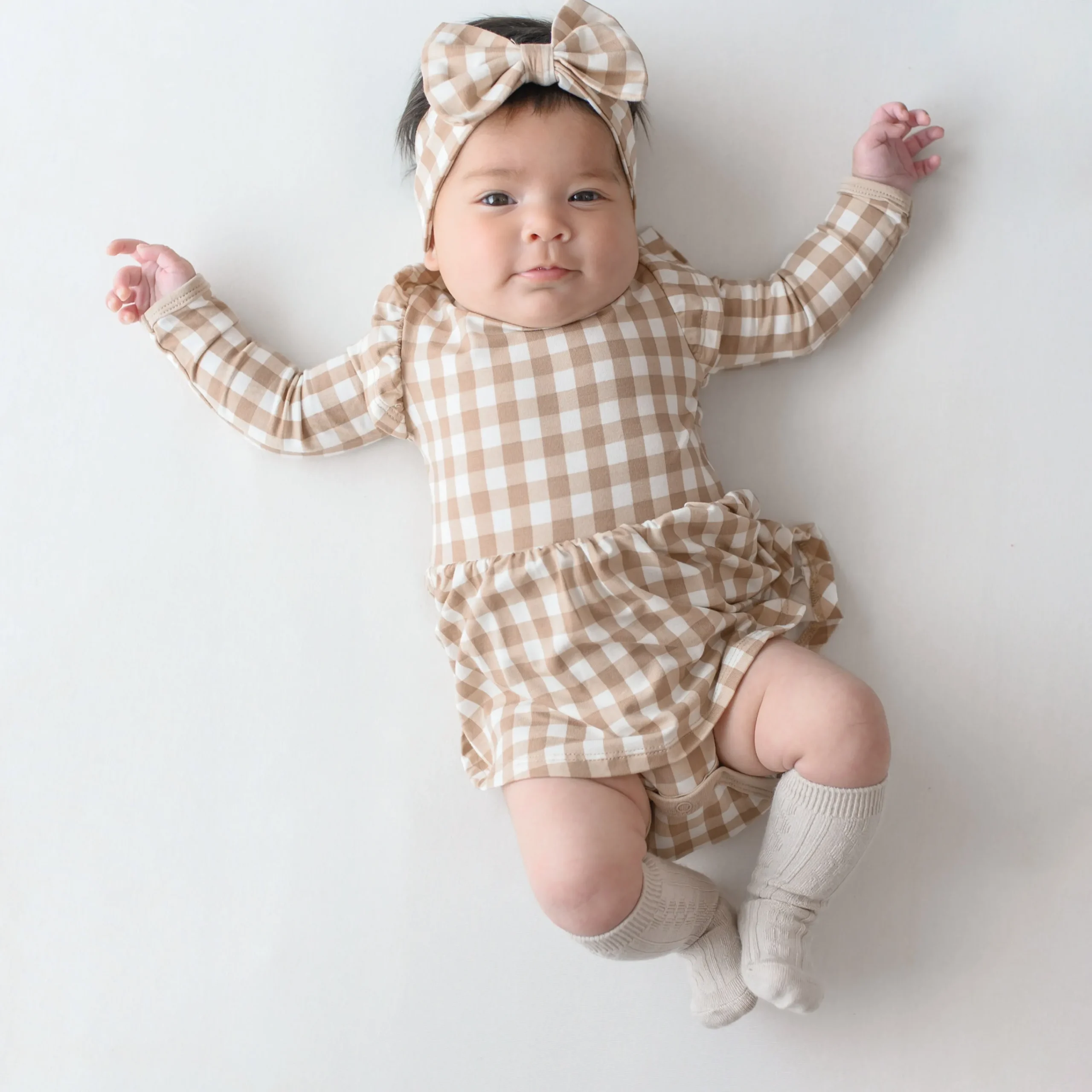 Kyte Baby Long Sleeve Twirl Bodysuit Dress in Gingham Bisque Outlet