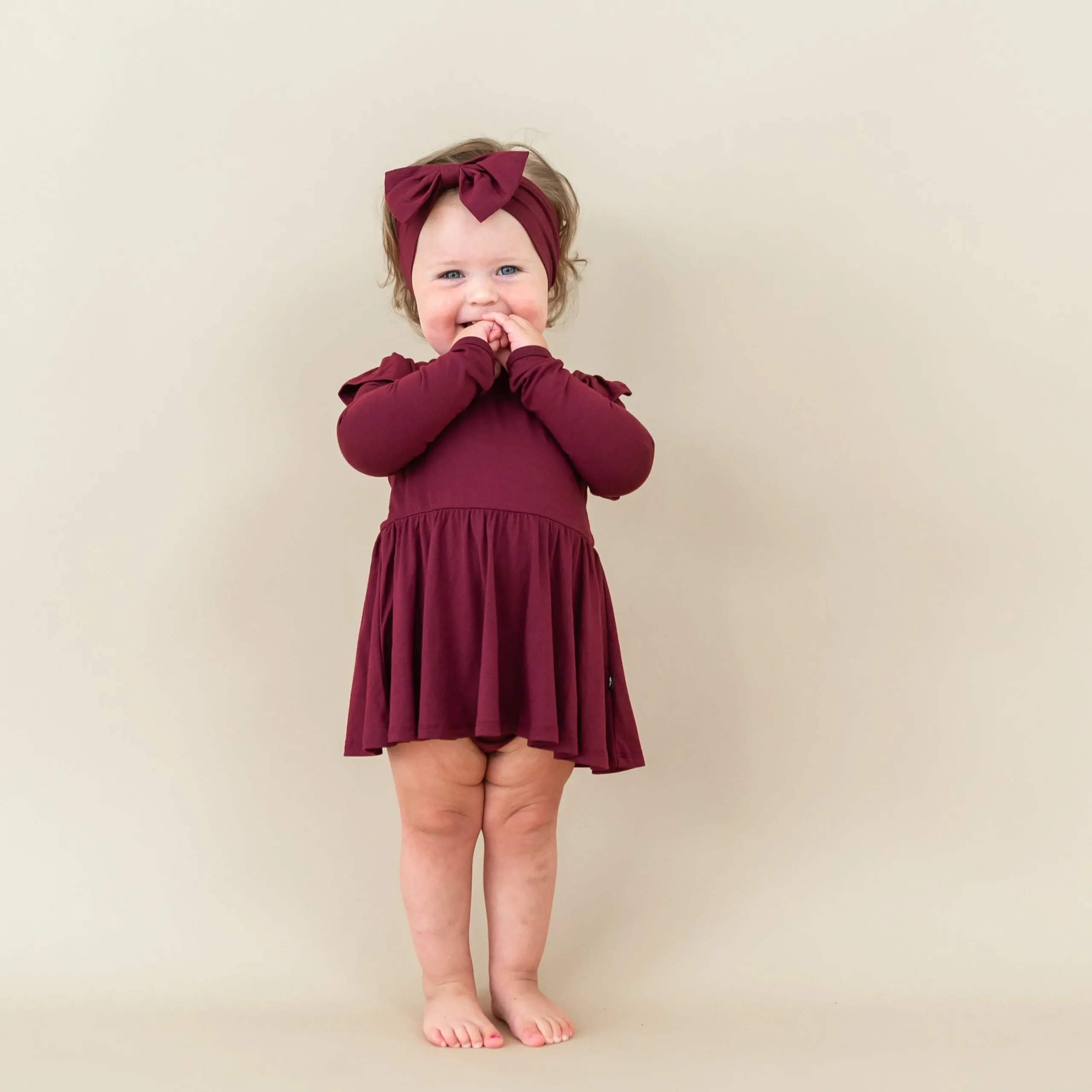 Kyte Baby Long Sleeve Twirl Bodysuit Dress in Burgundy Hot