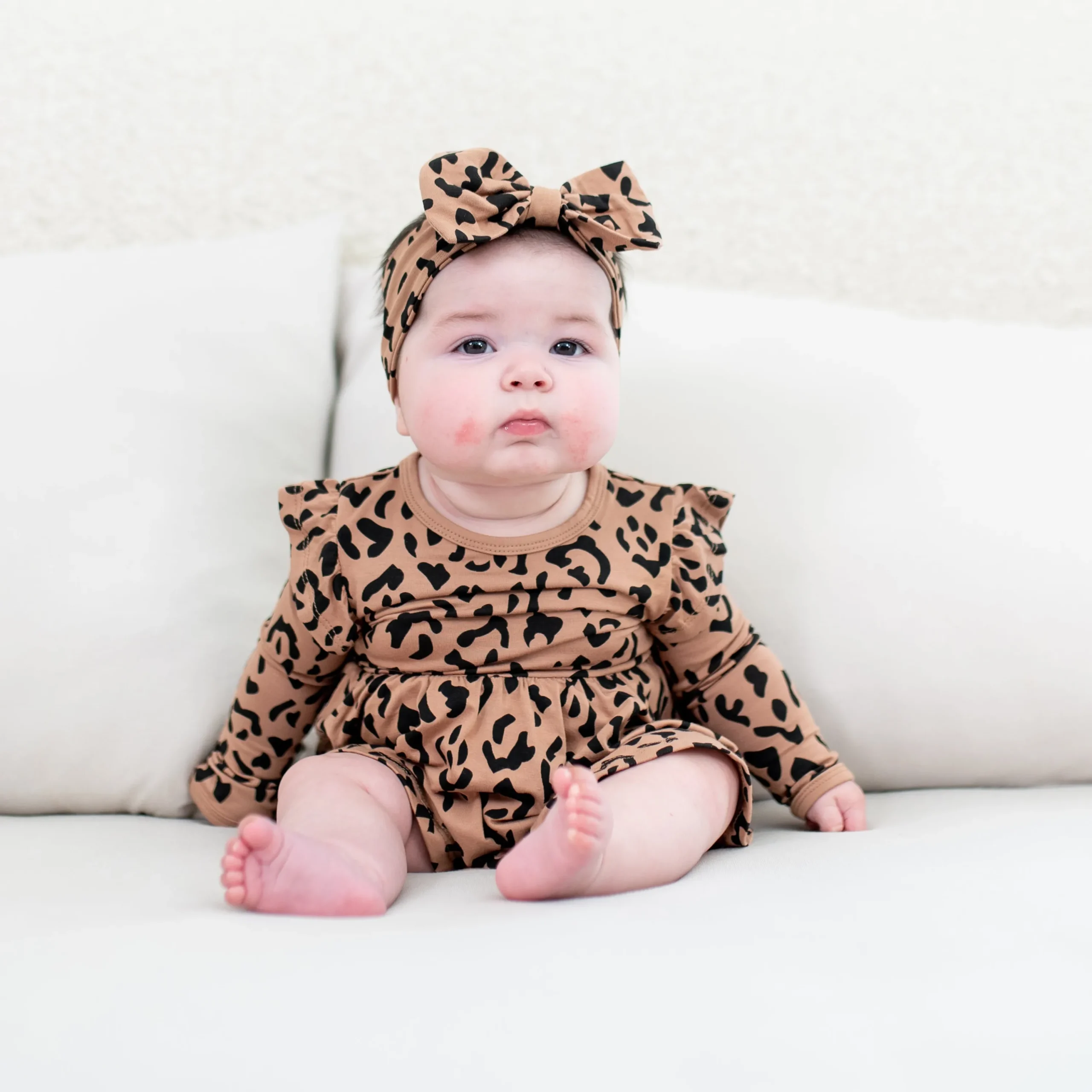 Kyte Baby Long Sleeve Twirl Bodysuit Dress in Latte Leopard Sale