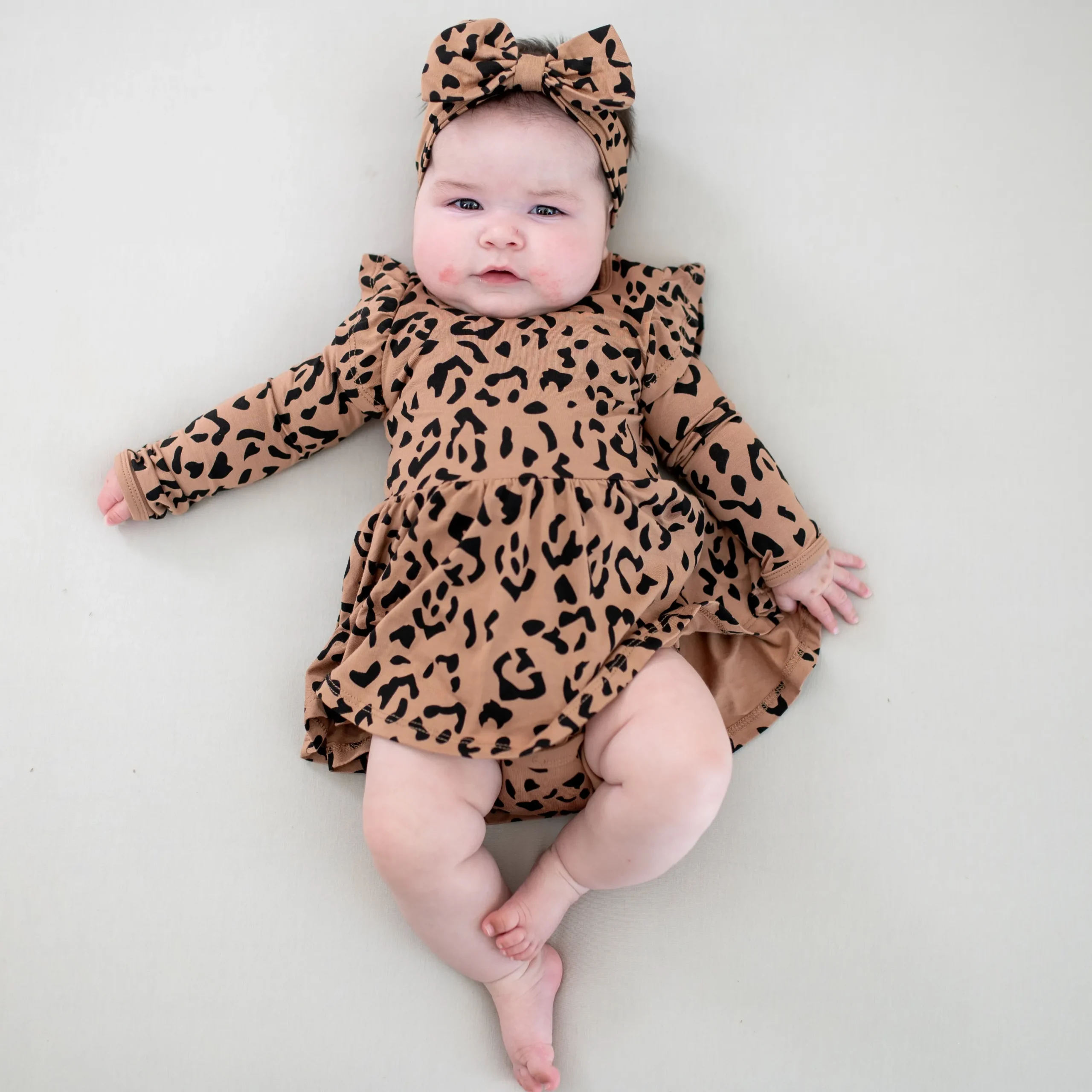 Kyte Baby Long Sleeve Twirl Bodysuit Dress in Latte Leopard Sale