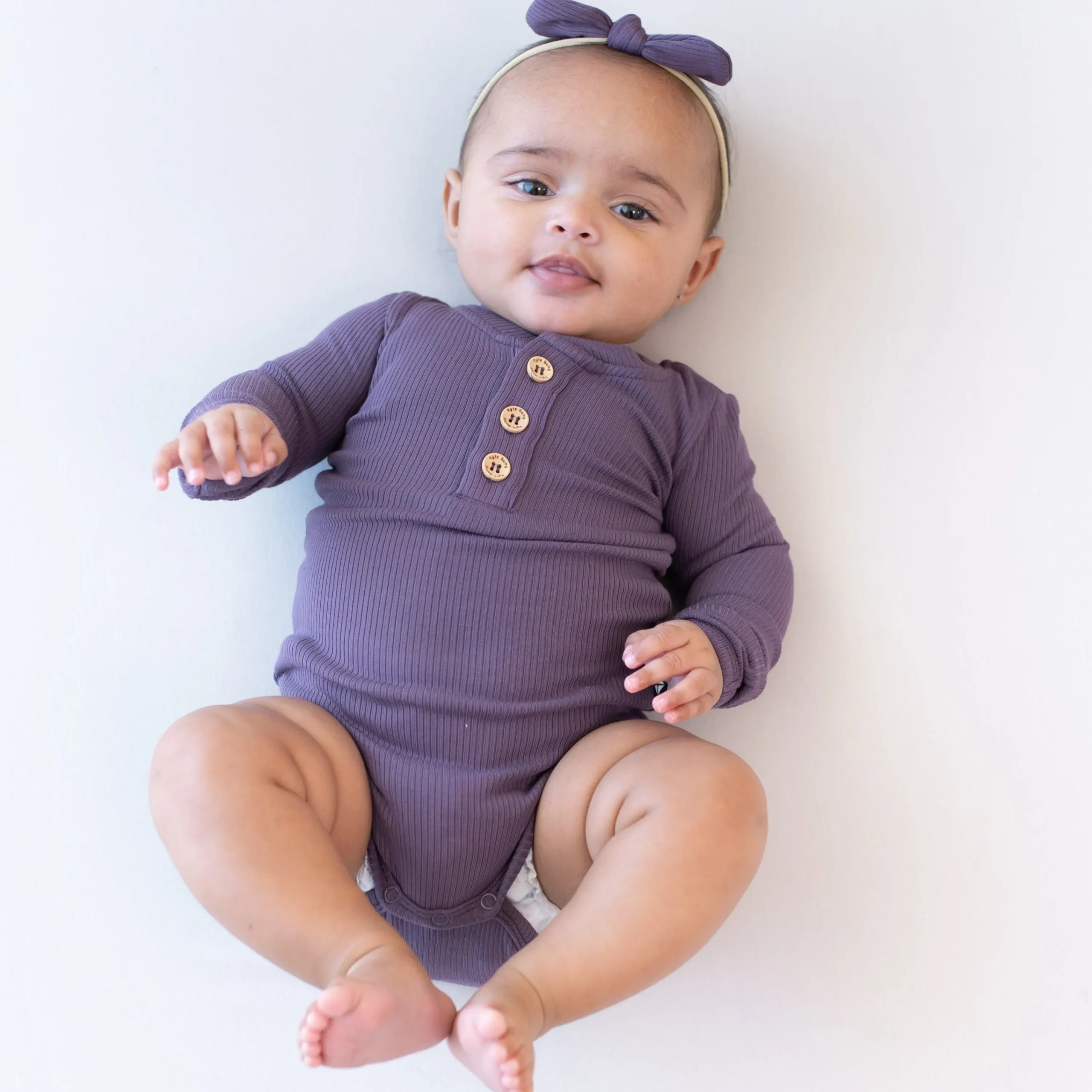 Kyte Baby Ribbed Long Sleeve Henley Bodysuit in Currant Online