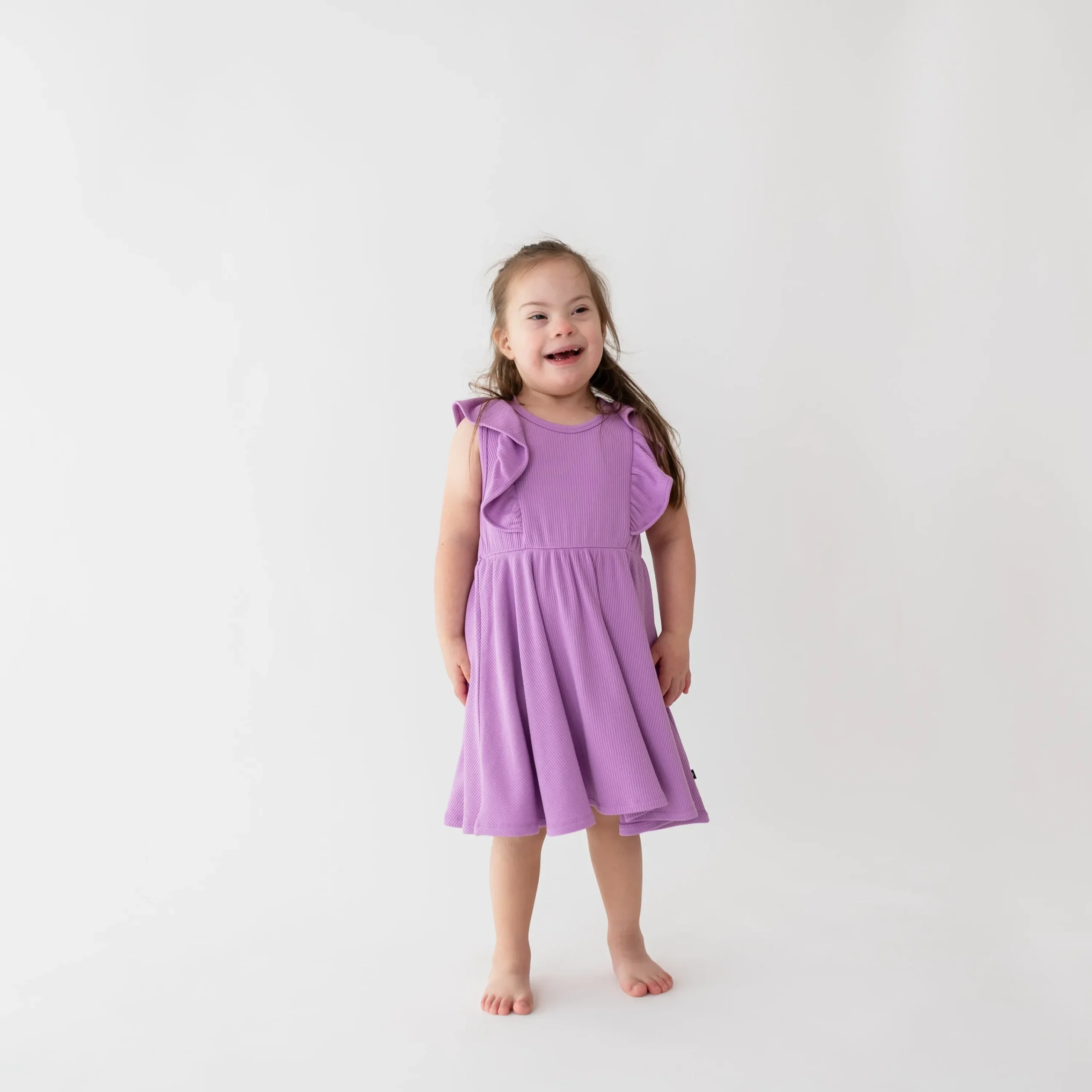Kyte Baby Ribbed Peplum Dress Set in Poi