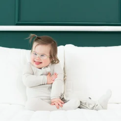 Kyte Baby Ribbed Ruffle Zipper Footie in Oat Best