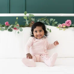 Kyte Baby Ribbed Ruffle Zipper Footie in Blush New