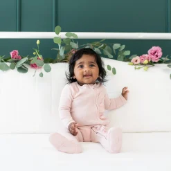 Kyte Baby Ribbed Ruffle Zipper Footie in Blush New