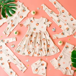 Kyte Baby Short Sleeve Tiered Dress in Peach Best