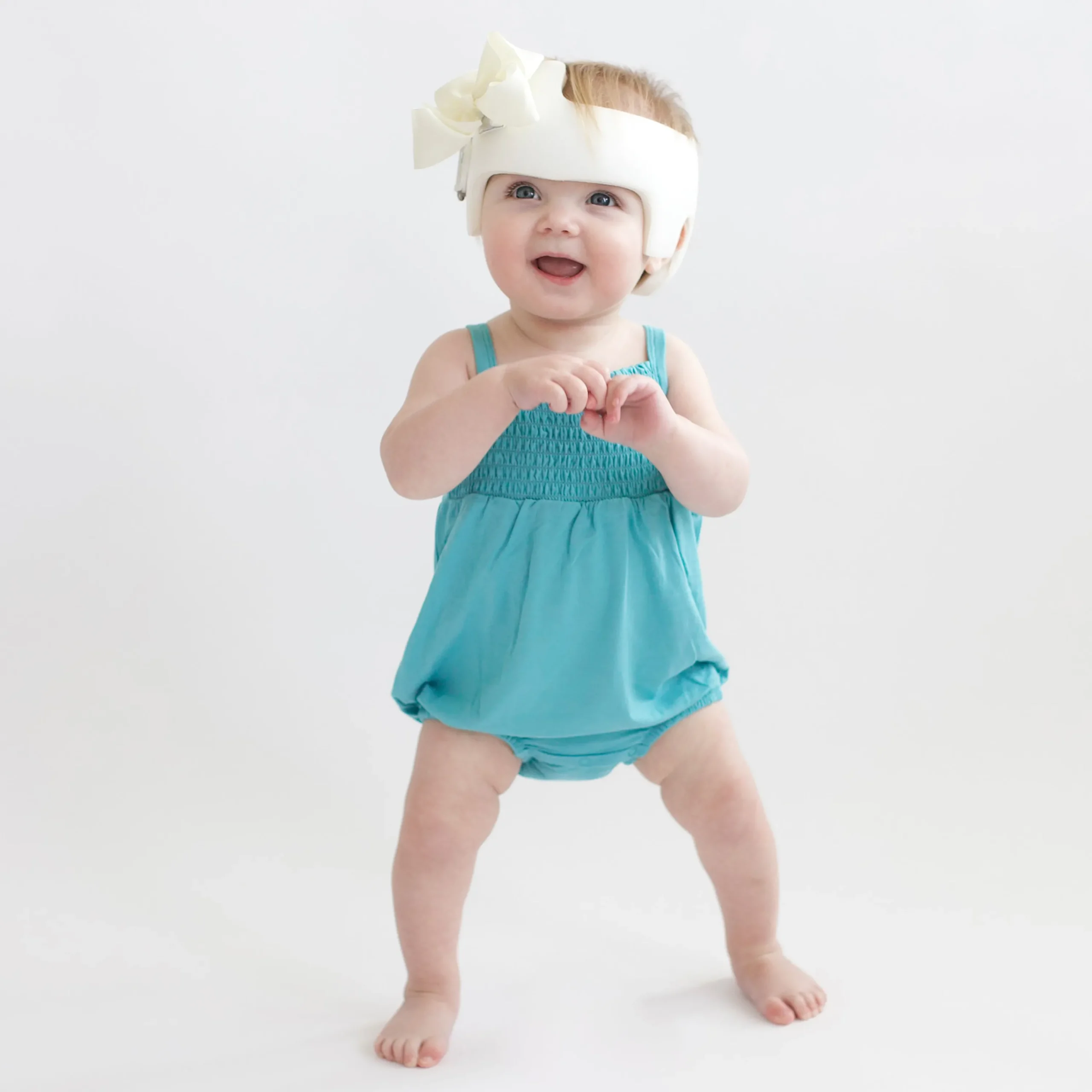 Kyte Baby Smocked Bubble Romper in Makai Best