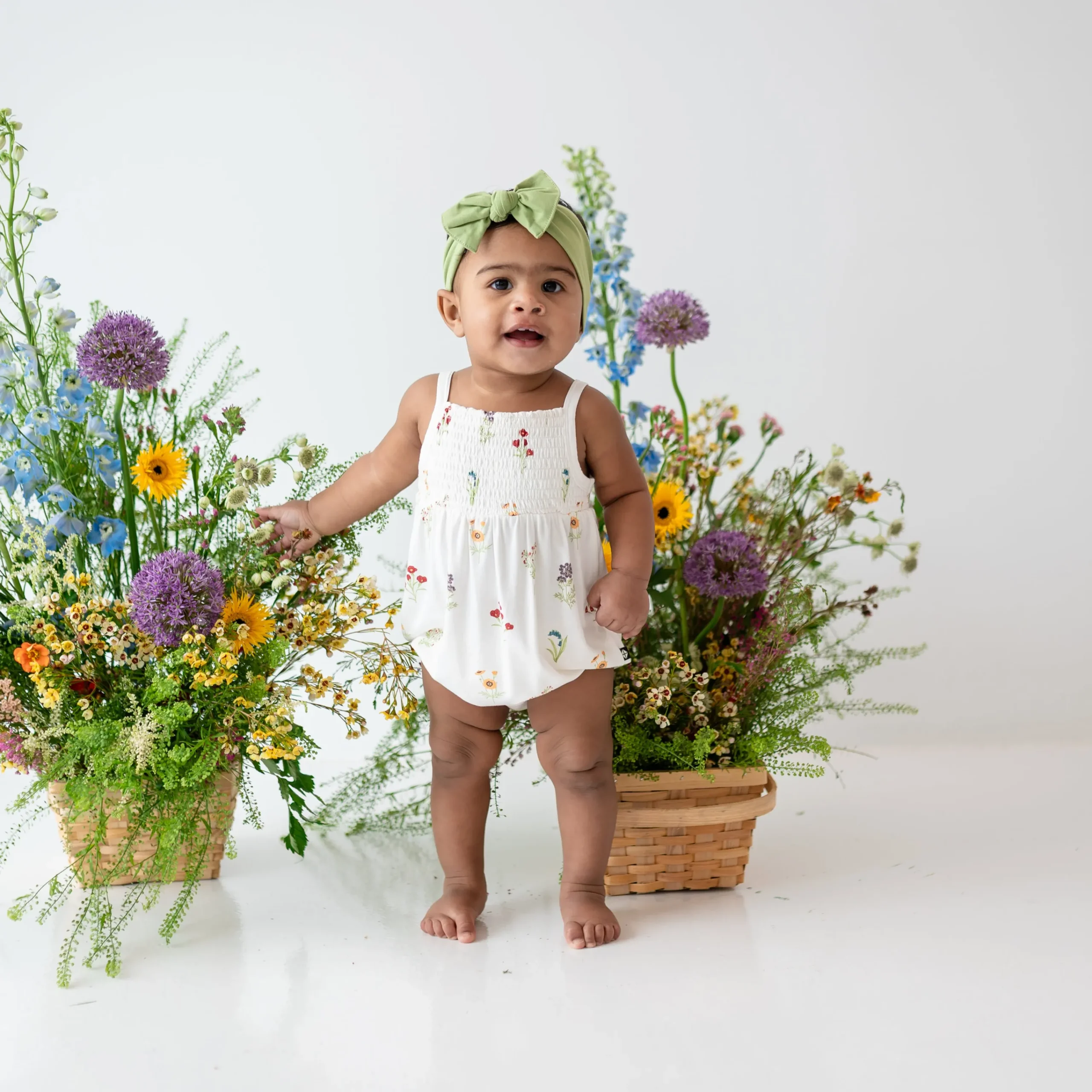 Kyte Baby Smocked Bubble Romper in Wildflower Discount