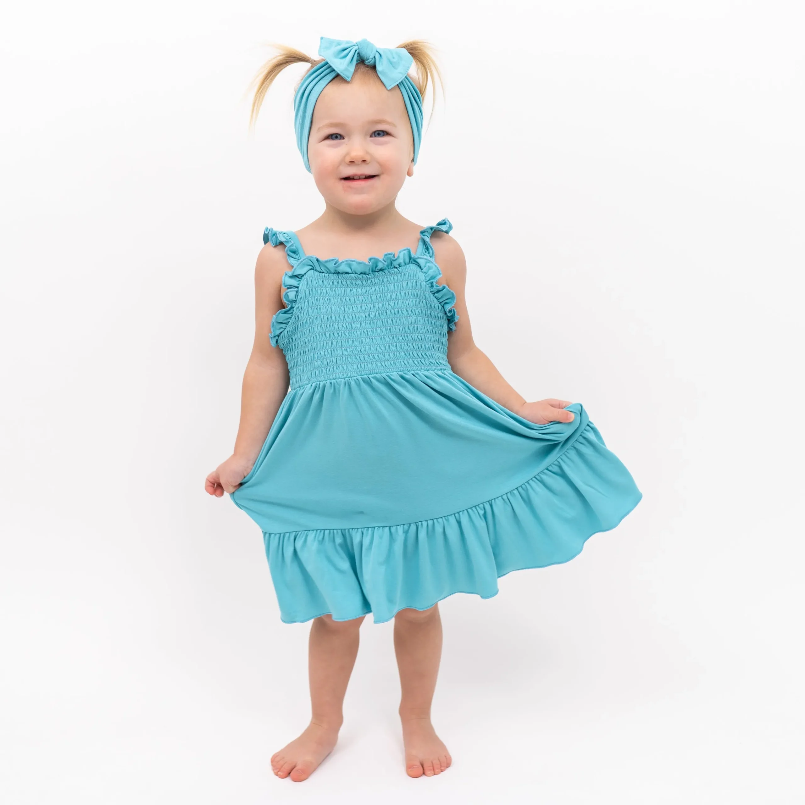 Kyte Baby Smocked Dress in Makai
