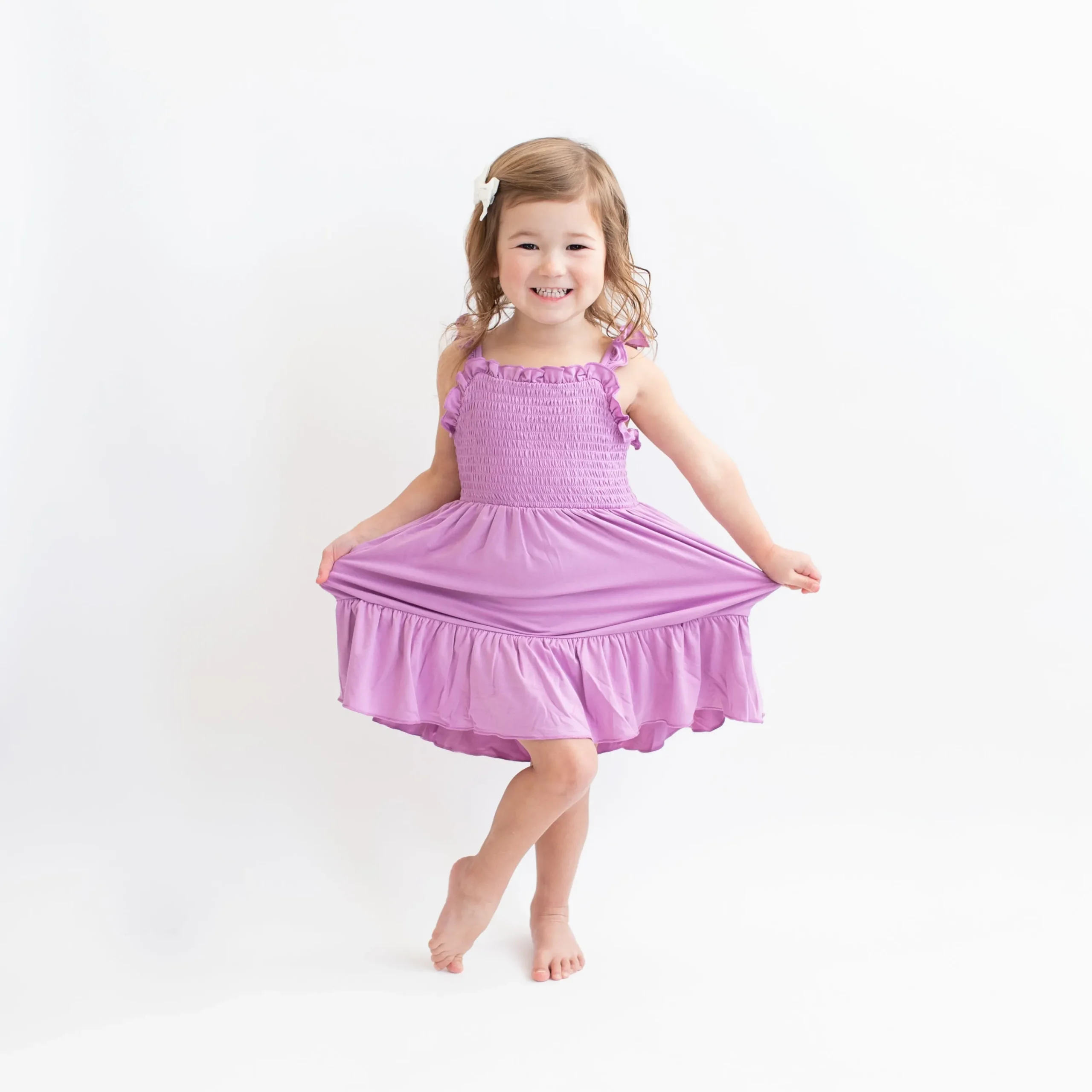 Kyte Baby Smocked Dress in Poi Best