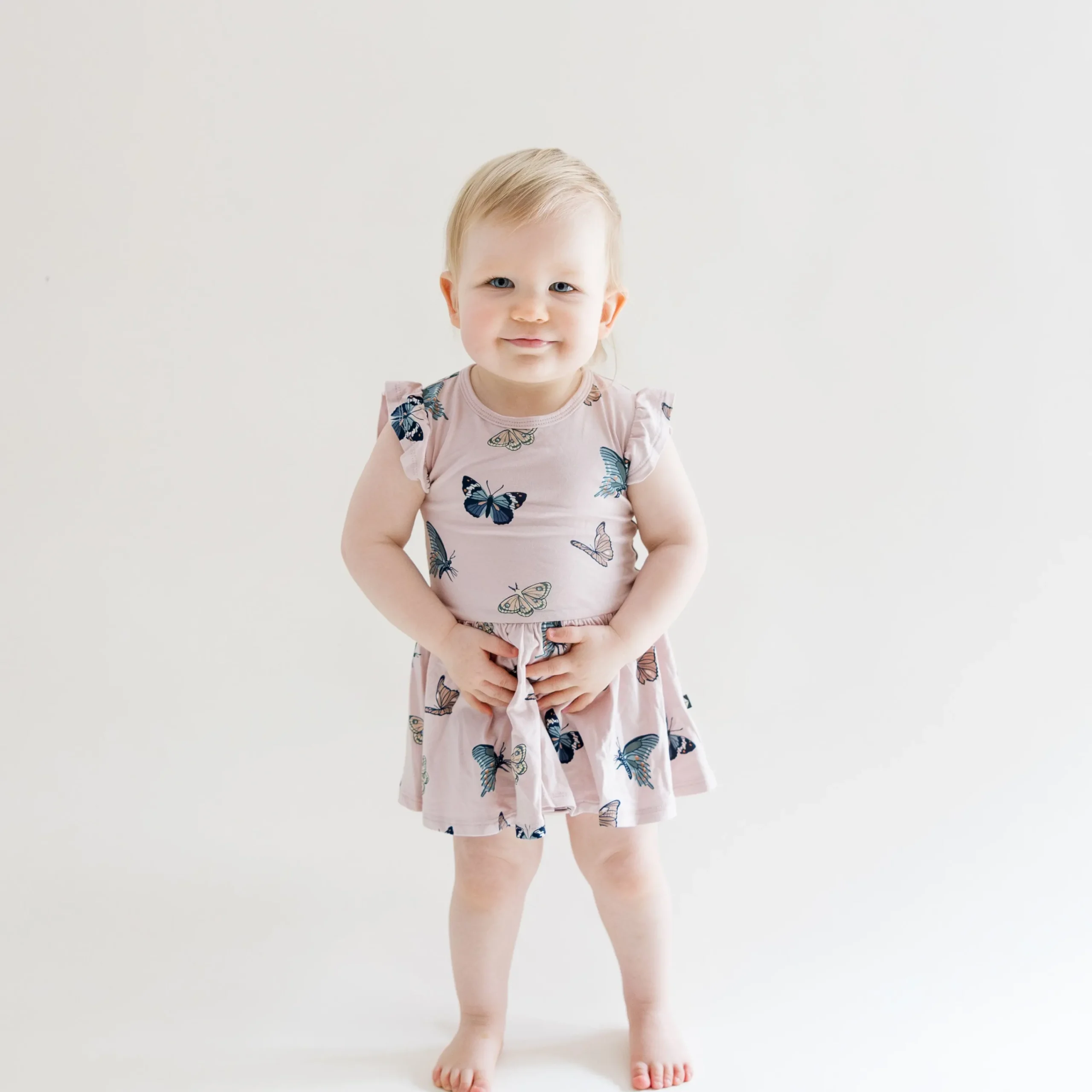 Kyte Baby Twirl Bodysuit Dress in Blush Butterfly Best