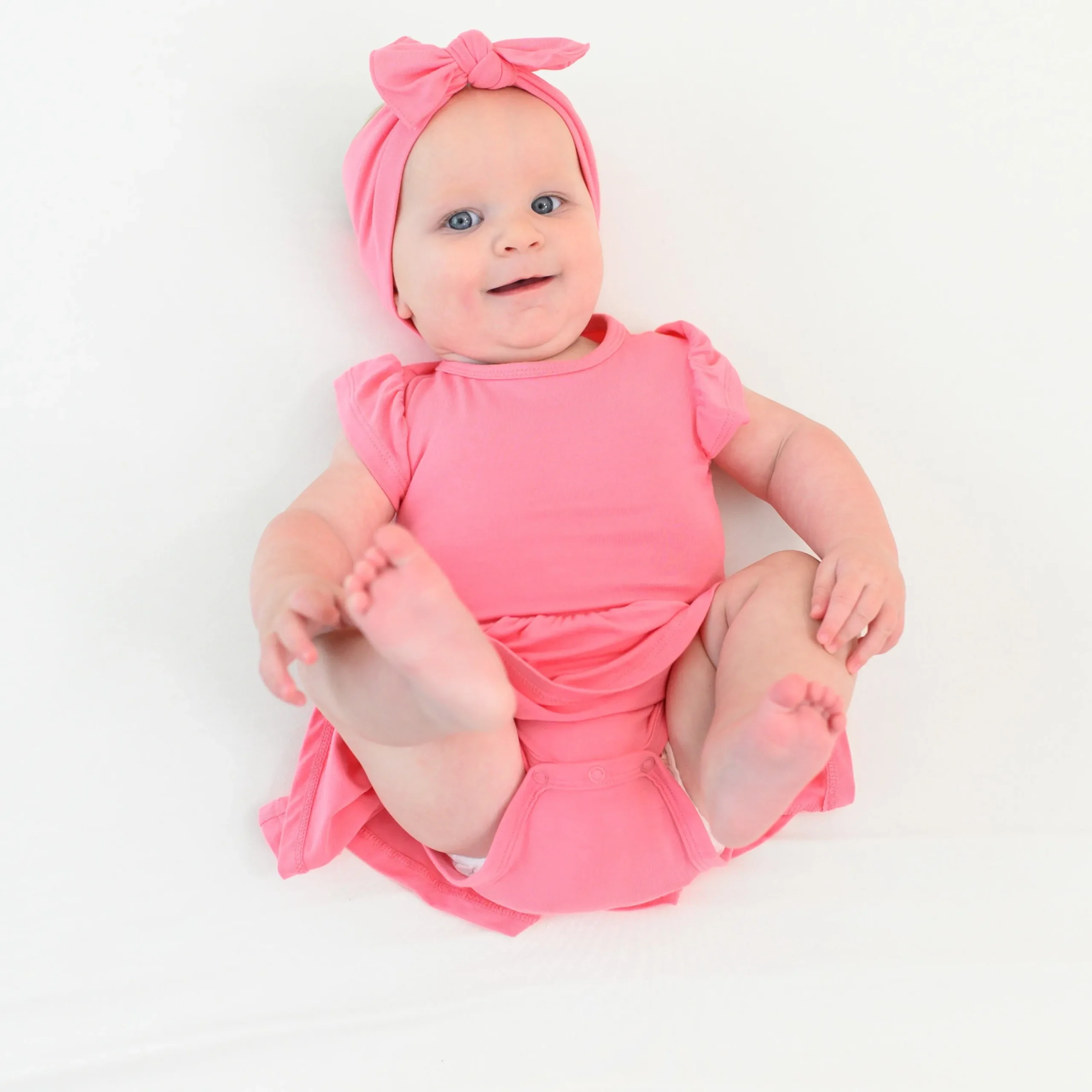 Kyte Baby Twirl Bodysuit Dress in Guava Clearance