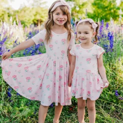 Kyte Baby Twirl Bodysuit Dress in Sakura Peony Best