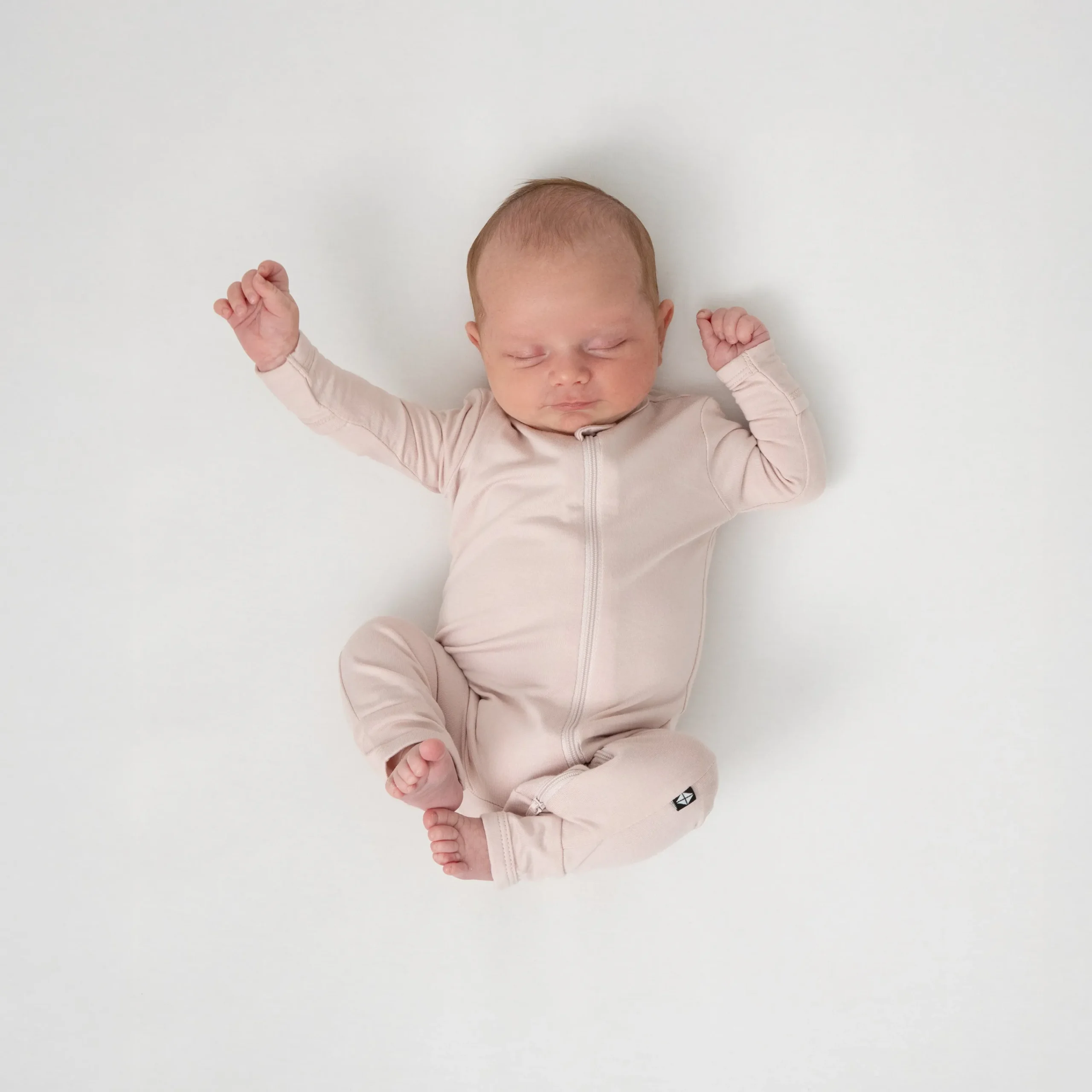 Kyte Baby Zippered Romper in Blush Discount