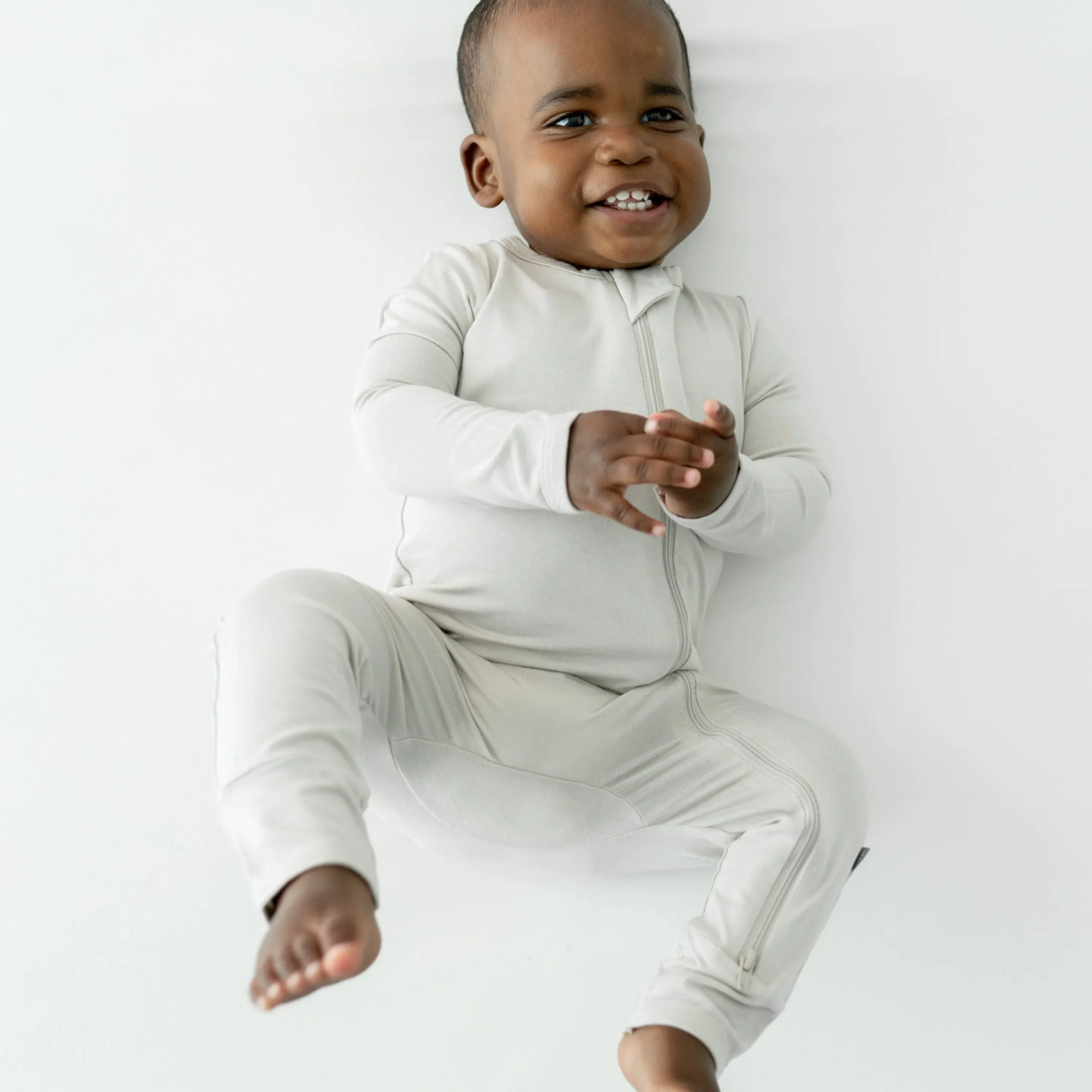 Kyte Baby Zippered Romper in Oat Outlet
