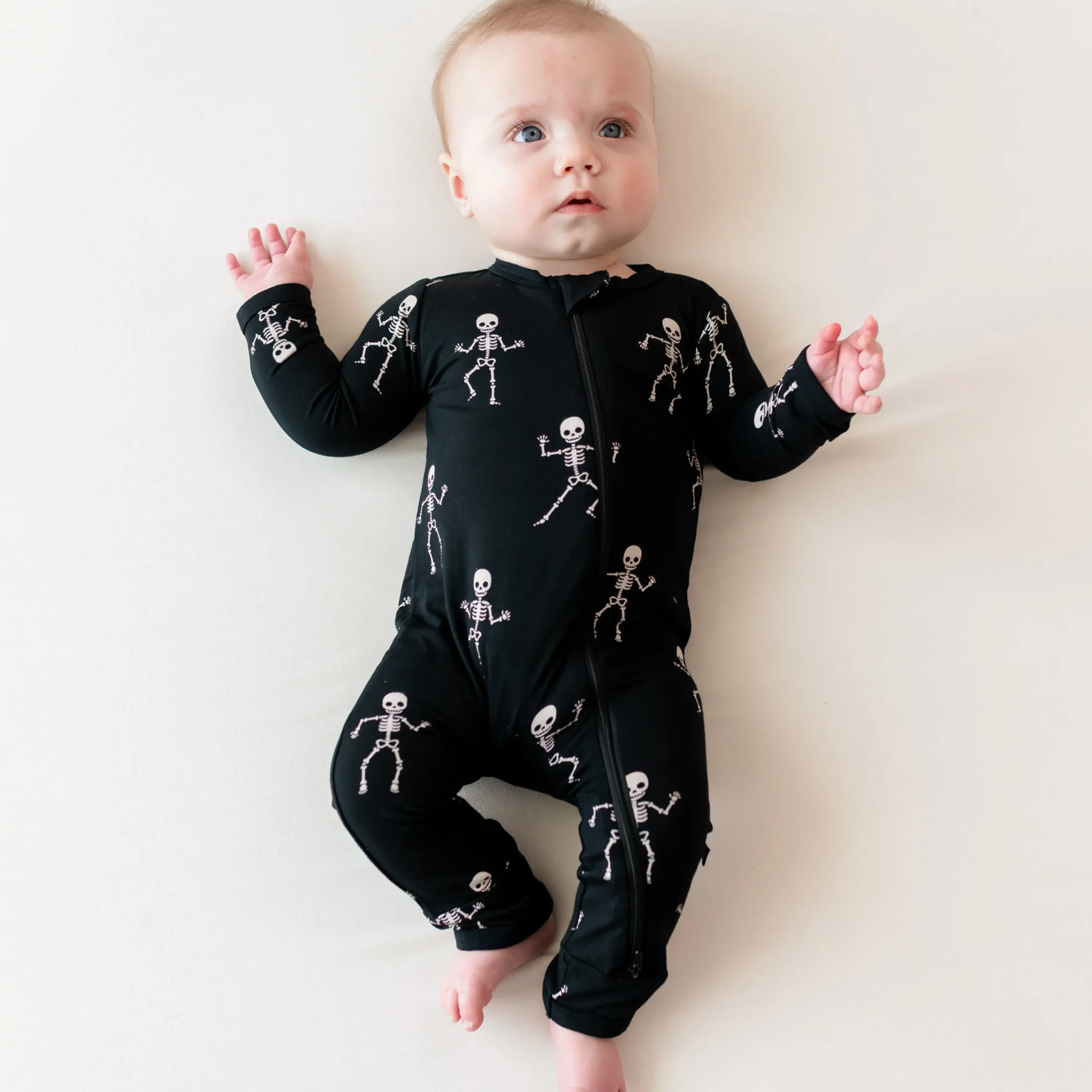 Kyte Baby Zippered Romper in Skeleton Best