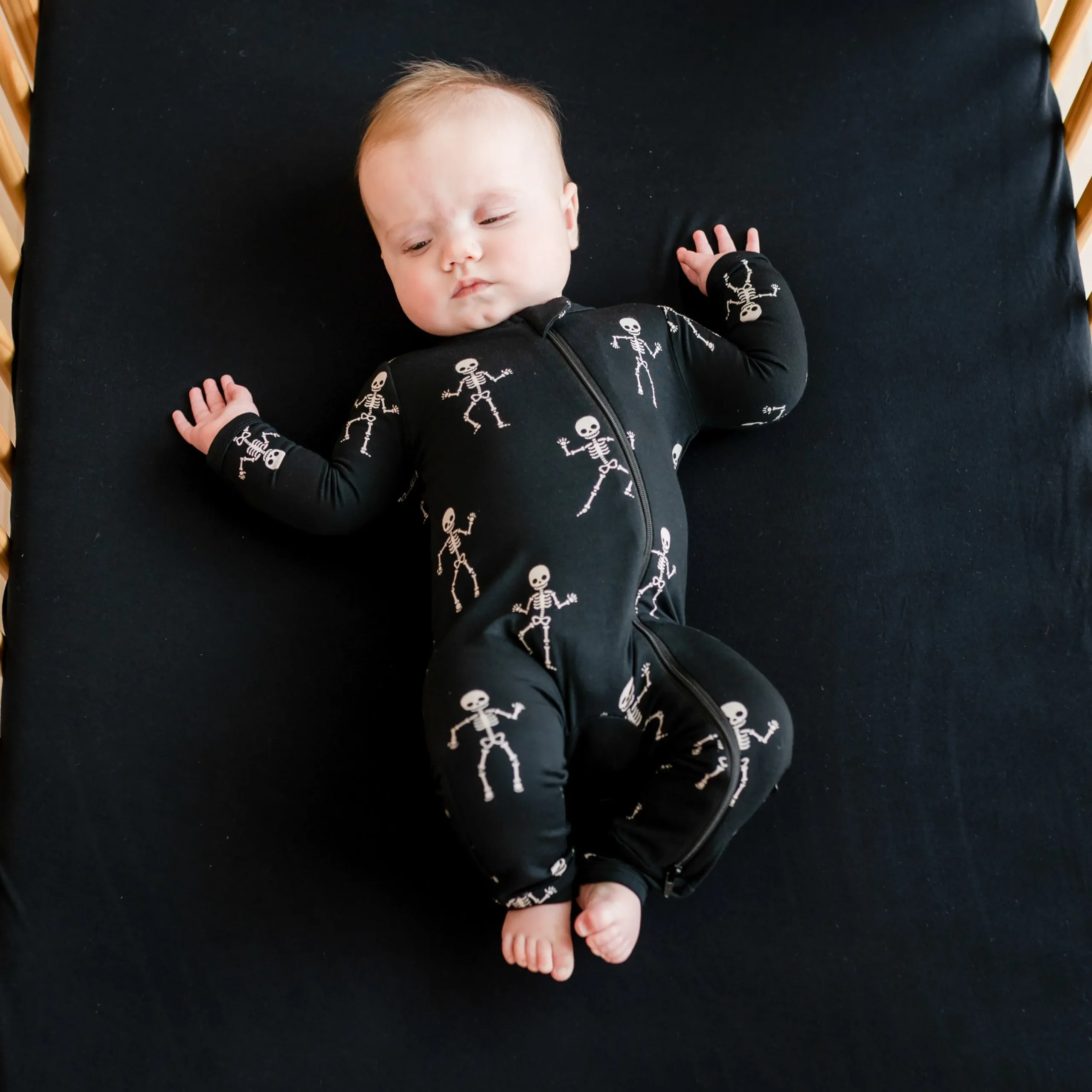 Kyte Baby Zippered Romper in Skeleton Best