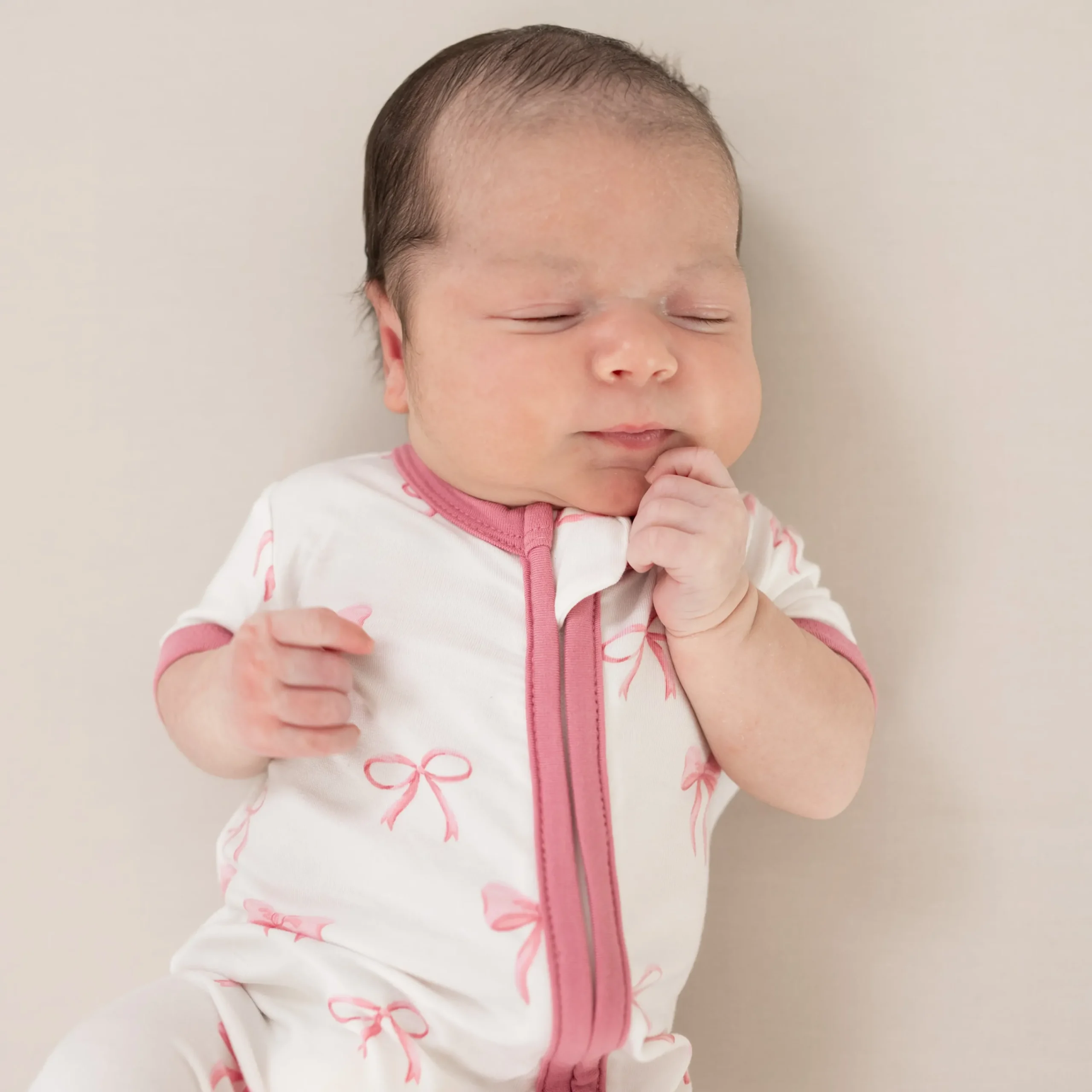 Kyte Baby Zippered Shortall Romper in Bow Best