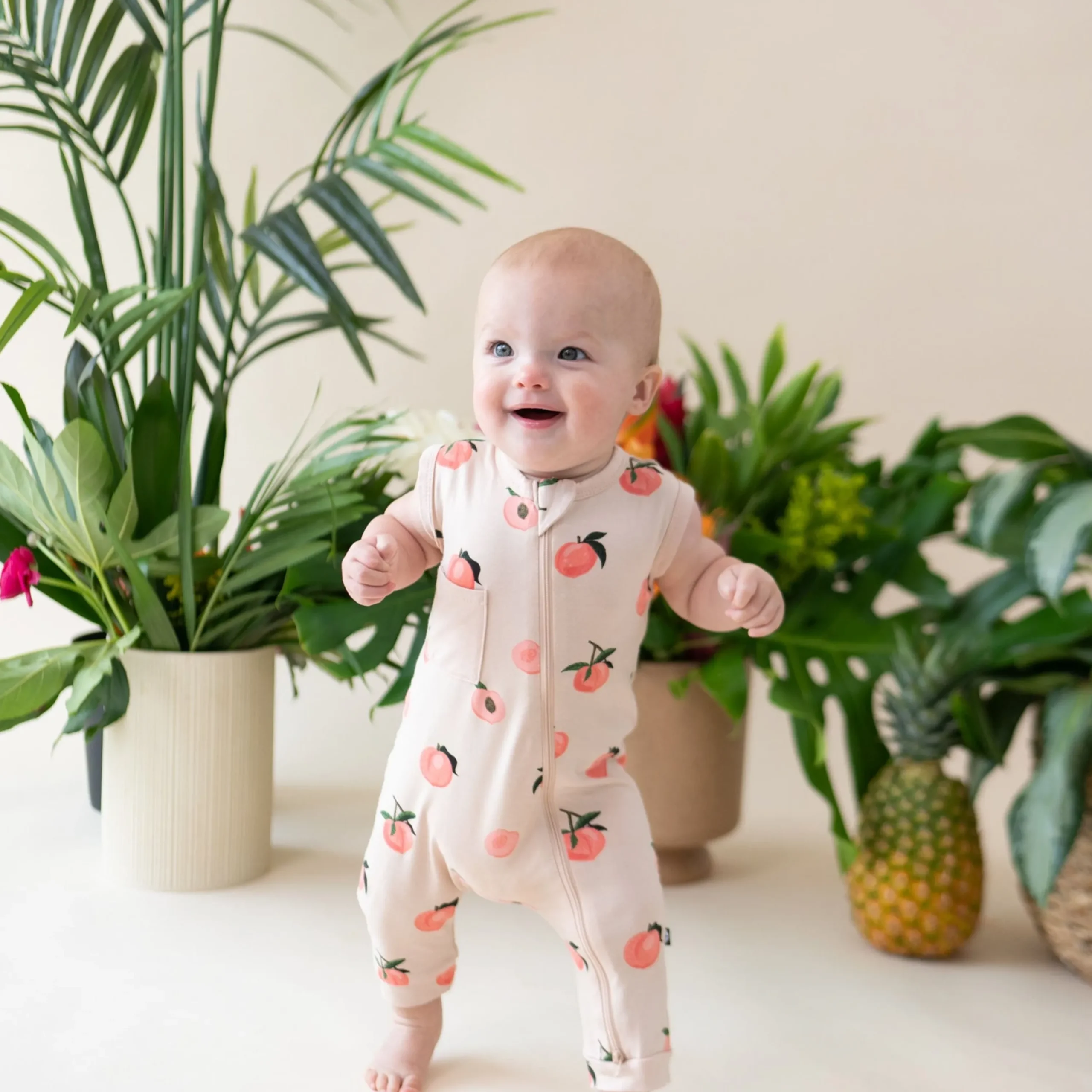 Kyte Baby Zippered Sleeveless Romper in Peach Sale